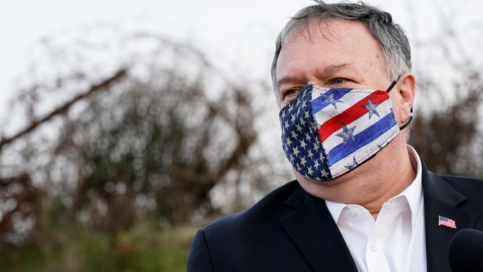 U.S. Secretary of State Mike Pompeo listens as Israeli Foreign Minister Gabi Ashkenazi speaks after a security briefing on Mount Bental in the Israeli-occupied Golan Heights November 19, 2020. Patrick Semansky/Pool via REUTERS